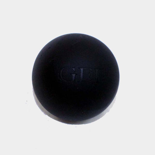 Firm rubber massage ball for relieving muscle tension and knots